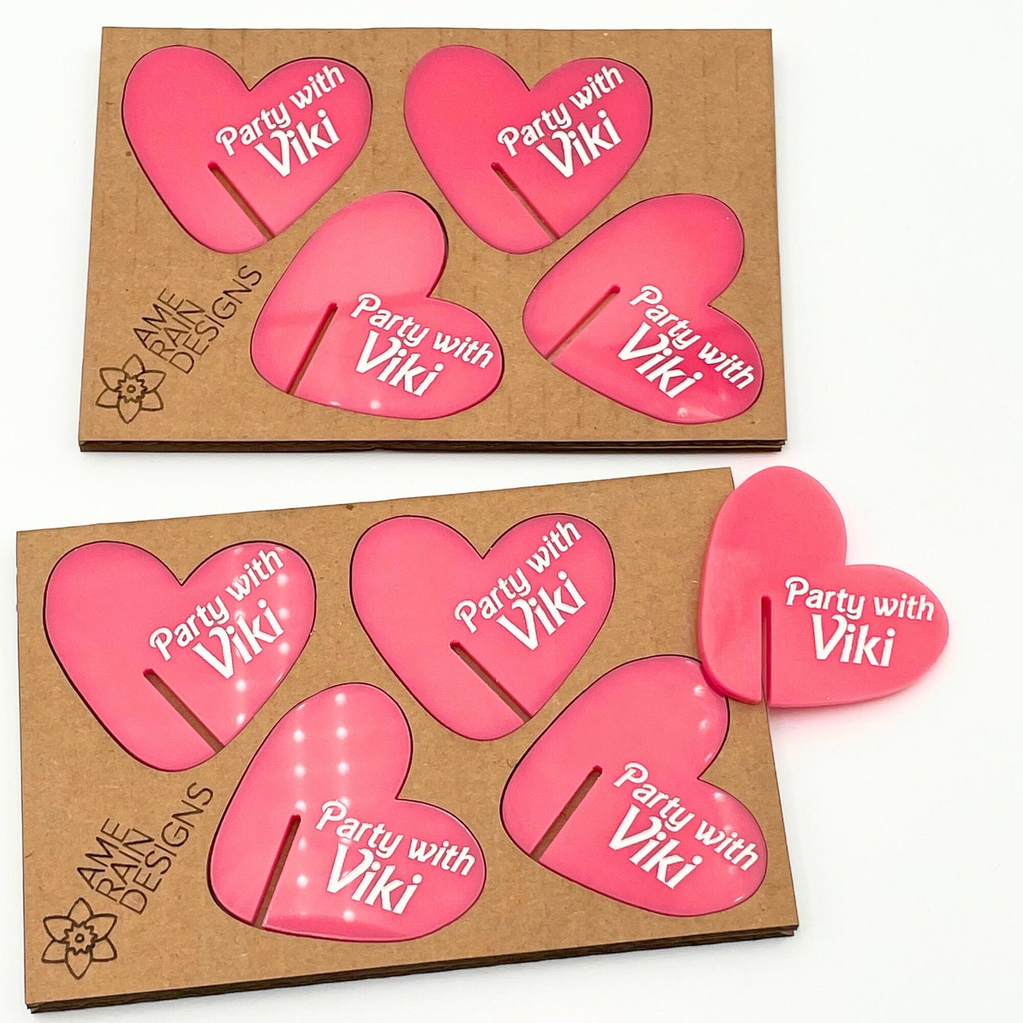 Demonstration of packaging for heart drink tags. I use recycled cardboard to make a cushioned frame for the hearts. Along with Ame Rain Designs logo engraved on it
