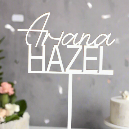 White cake topper with name “Ariana Hazel”