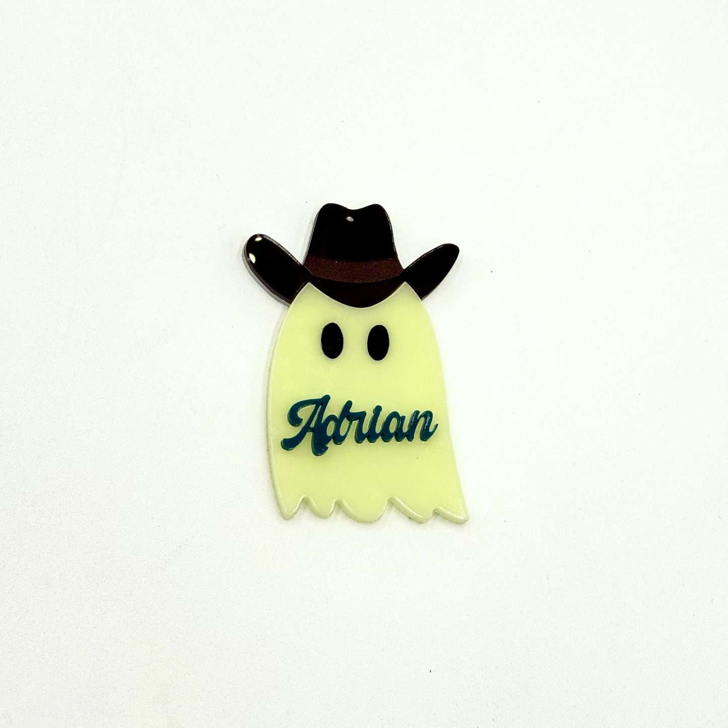 Western ghost tag with brown hat and teal text
