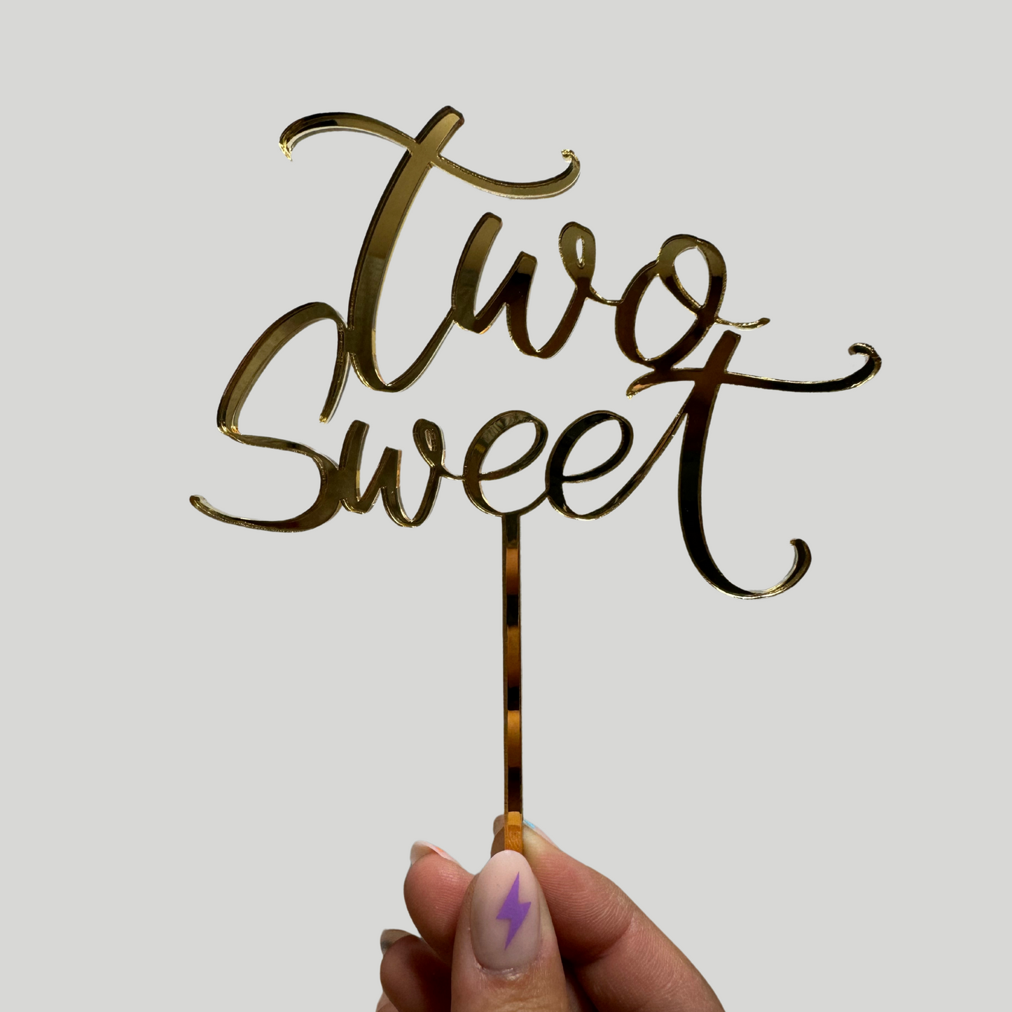 Two sweet cake topper in gold