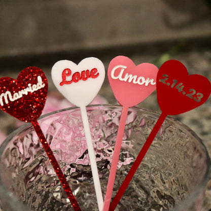 4 drink stirrers all in different acrylic colors and engravings to demonstrate variety of options