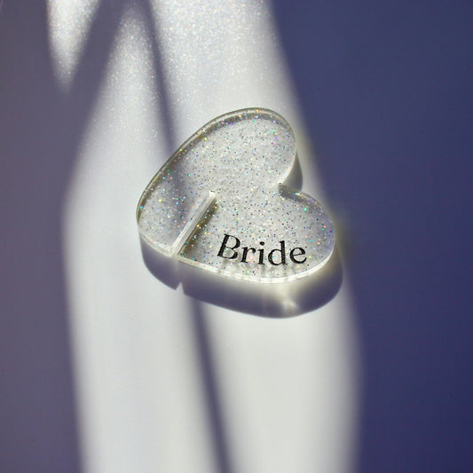 Confetti glitter acrylic heart shaped drink tag with “bride” engraved in black