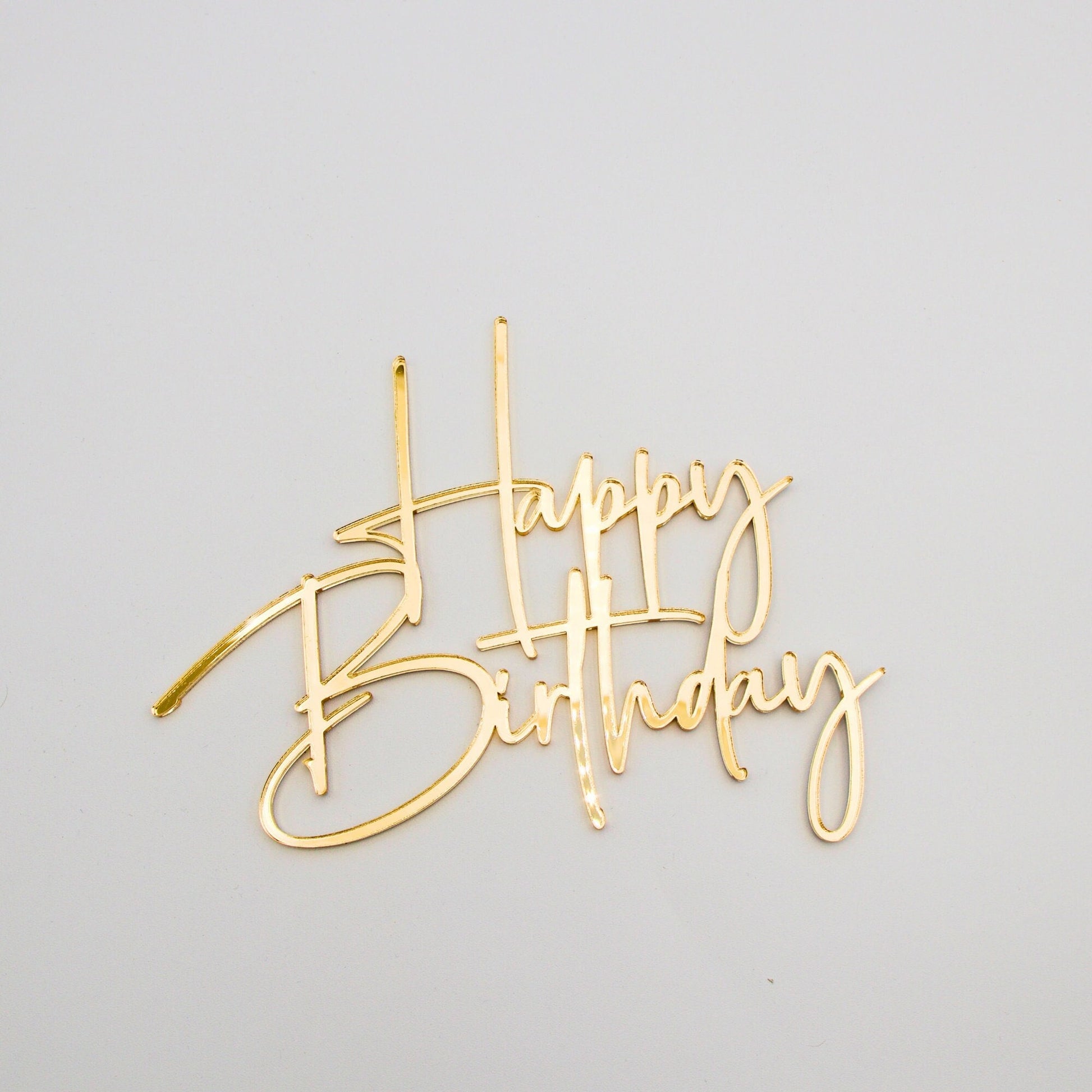 Close up of happy birthday cake charm