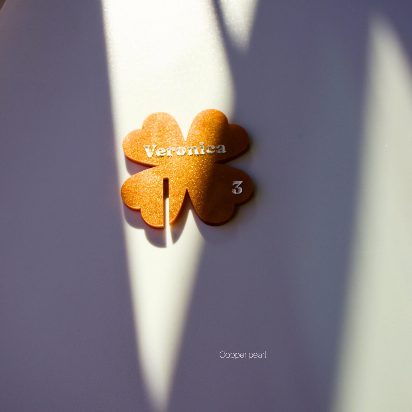 Front facing Copper pearl shamrock drink tag with engraved name and table number