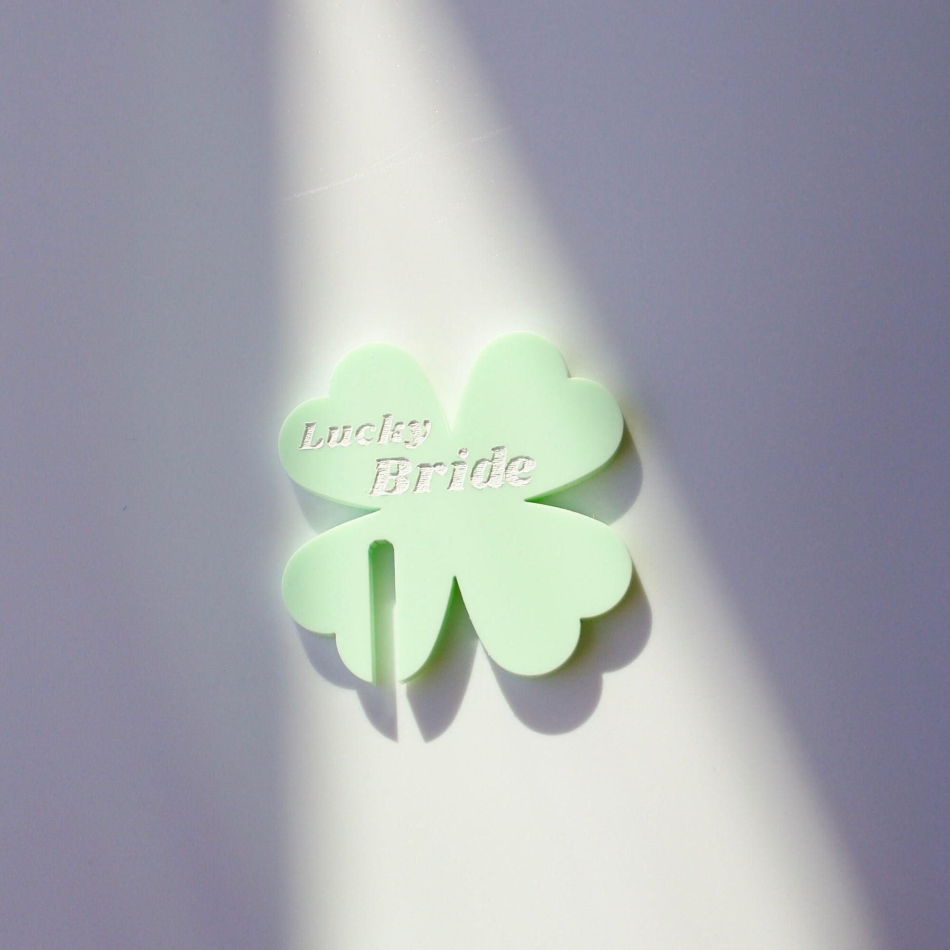 Front facing Close up of shamrock drink tag in pastel green