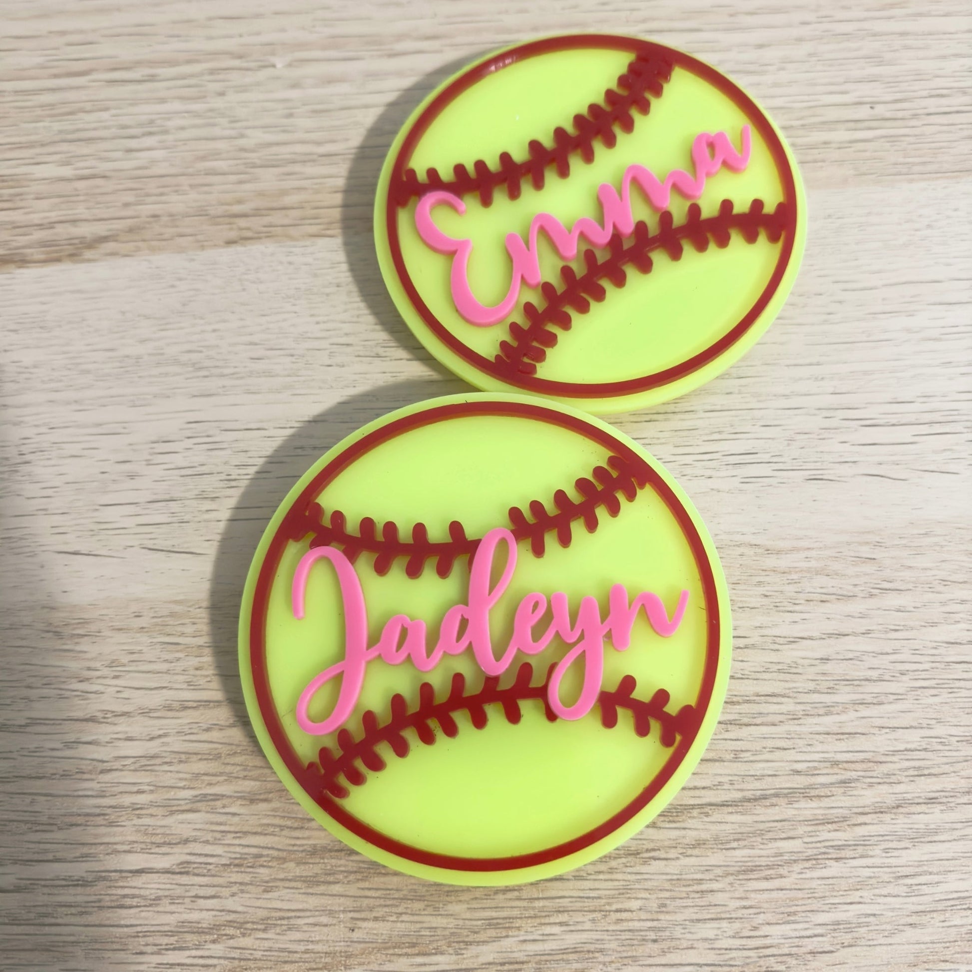 2 softball bogg tags with hot pink text